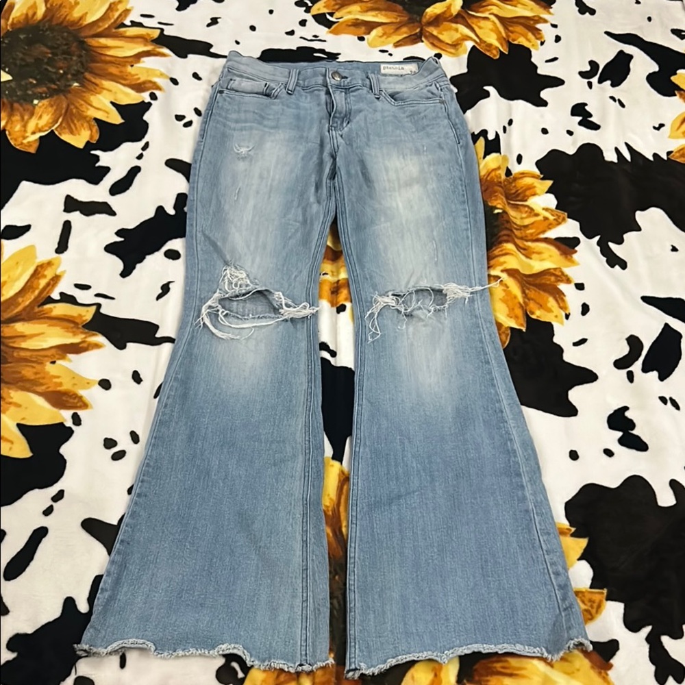 Distressed wide leg blue jeans